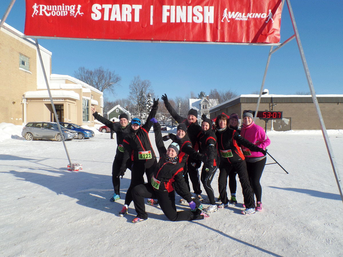 Lacey Clowater celebrates with friends after completing this year’s Resolution Run in Fredericton. The group inspired and convinced her to run a half marathon.