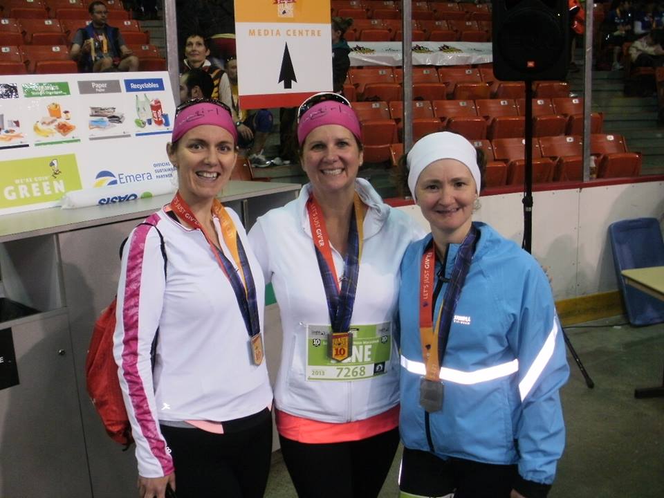 Tracy Beaulieu, far right, celebrates with Michelle Darrell, left, and June Wilson at the 2013 Blue Nose Marathon in Halifax.